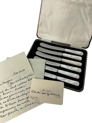 Lot 183 - Set of six 1930s tea knives with mother of pearl handles, in original fitted case and note dated 1935