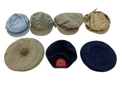 Lot 793 - Second World War British Paratroopers / Despatch Riders helmet shell, French steel helmet, British MK III pattern steel helmet and group of berets and cloth caps.