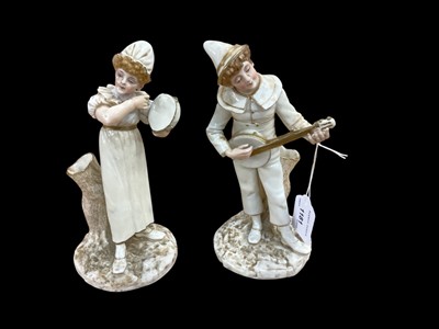 Lot 1181 - Pair of Royal Worcester blush ivory figural spill holders