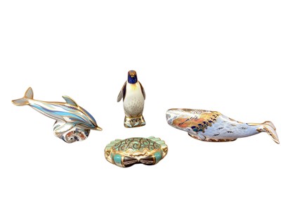 Lot 1270 - Four Royal Crown Derby paperweights - Oceanic Whale, Dolphin, Cromer Crab and Emperor Penguin