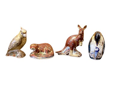 Lot 1272 - Four Royal Crown Derby paperweights - Citron Cockatoo, Otter, Kangaroo (signed) and Penguin