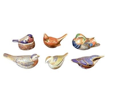 Lot 1279 - Six Royal Crown Derby bird paperweights including Bullfinch Nesting and American Cardinal