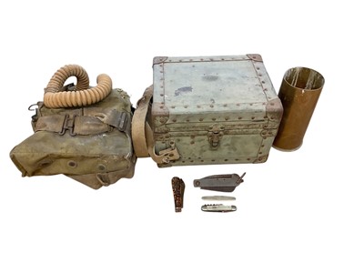 Lot 893 - Second World War gas mask in canvas webbing bag, together with group of knives and a brass shell case (1 box).