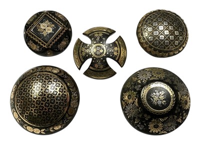 Lot 216 - Group of five 19th century tortoishell piqué work brooches, with floral and lattice work decoration. 32-35mm diameter