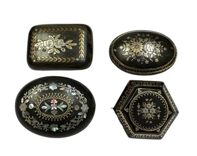 Lot 219 - Group of four 19th century tortoishell piqué work brooches with floral decoration. 35mm-45mm