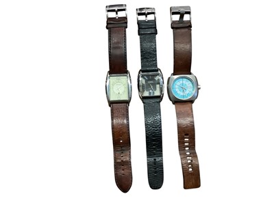 Lot 1102 - Two Fossil wristwatches and a Diesel wristwatch all on leather straps (3)