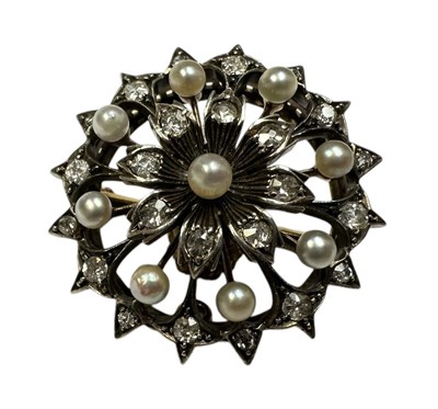 Lot 230 - Late Victorian diamond and seed pearl pendant / brooch of snowflake design, with flower-head cluster centred with a pearl and eight old cut diamond set petals in an openwork design, with eight f...