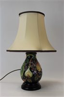 Lot 2011 - Moorcroft pottery table lamp decorated in the...
