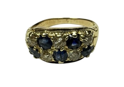 Lot 232 - Late Victorian diamond and sapphire ring with a double row of old cut diamonds alternating with mixed cut blue sapphires. Ring size J