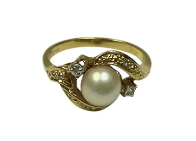 Lot 235 - 18ct gold cultured pearl ring with diamond set cross over shoulders, size L