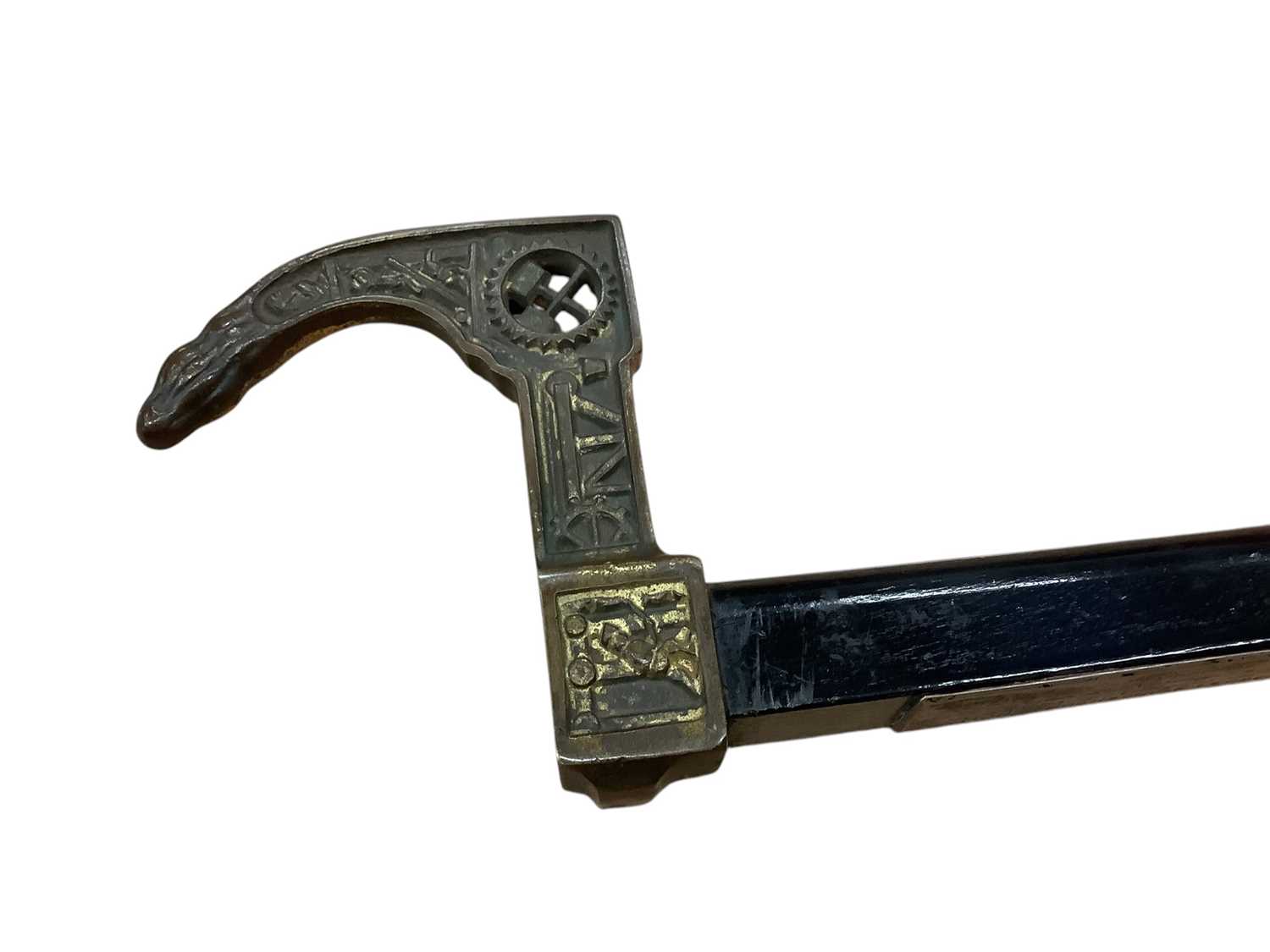 Lot 2549 - German Miner’s Guild hatchet cane from 1946, with Ebonised shaft, mounted with a symbolic, gilt metal miner’s hatchet handle and engraved presentation plaque “Fur freundlichen Erinnerung an der...