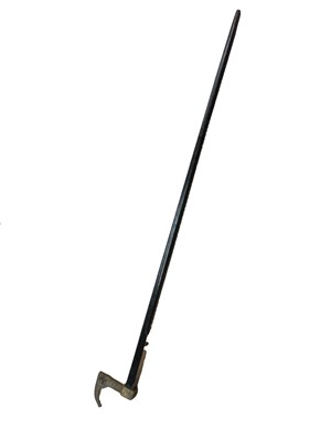 Lot 2549 - German Miner’s Guild hatchet cane from 1946, with Ebonised shaft, mounted with a symbolic, gilt metal miner’s hatchet handle and engraved presentation plaque “Fur freundlichen Erinnerung an der...