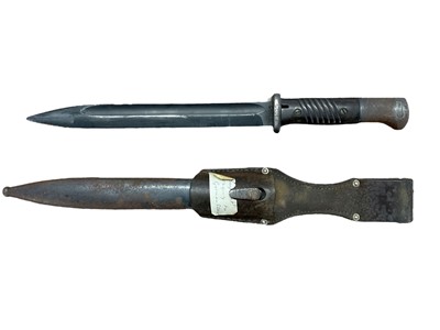 Lot 986 - Second World War Nazi German M84/98 bayonet with steel blade stamped 7518h, S/24436, in steel scabbard with leather frog.