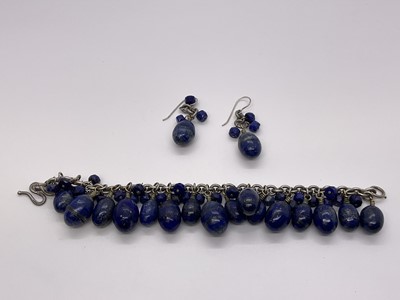 Lot 248 - Silver and lapis lazuli bracelet and earrings, the silver chain links suspending egg-shaped lapis lazuli pendant drops, bracelet hallmarked London 2004.