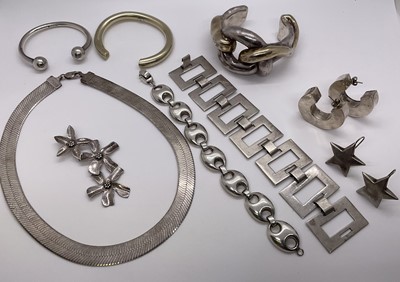 Lot 251 - Group of silver jewellery to include a Mexican silver bracelet of modernist design, three silver torque bangles, silver mariner link bracelet, silver snake-link collar necklace, two pairs of ear...