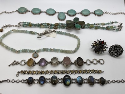 Lot 254 - Group of silver and gem-set jewellery to include a silver and labradorite necklace, faceted aquamarine bead necklace, silver bracelet with amethyst citrine and carved quartz, two multi-gem rings...