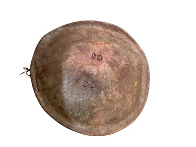 Lot 938 - Old African dried animal hide circular shield, 48.5cm in diameter.