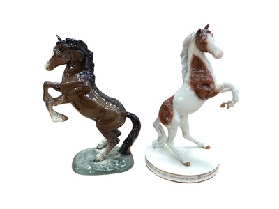 Lot 1306 - Beswick rearing horse, model 1014, together with a limited edition Royal Doulton Pinto, no. 0038 of 1500 (2)