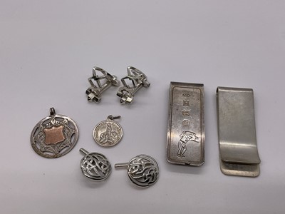 Lot 255 - Two silver money clips, two pairs of silver cufflinks and two silver fobs