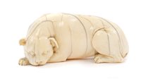 Lot 941 - Early European carved ivory figure of a hound,...