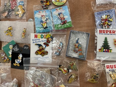 Lot 2603 - Collection of enamel bagels and pins including Blue Peter, Noddy, Flintstones, Tin Tin, Disney, Paddington, Rupert The Bear, etc