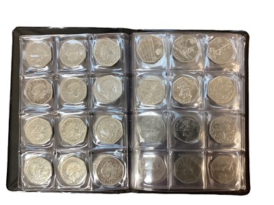 Lot 593 - G.B. - Two coin albums containing a quantity of mixed cupro-nickel 50p's, brass £1's, £2's taken from circulation to include a Kew Gardens Fifty Pence 2009 A. UNC (Qty)