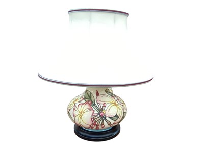 Lot 1323 - Moorcroft pottery table lamp with floral decoration on cream ground