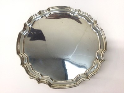 Lot 1026 - George III style silver salver with piece crust edge on scroll feet