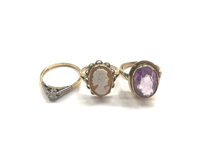 Lot 1028 - 18ct gold diamond single stone ring, 9ct gold carved shell cameo ring and a 9ct gold amethyst ring (3)