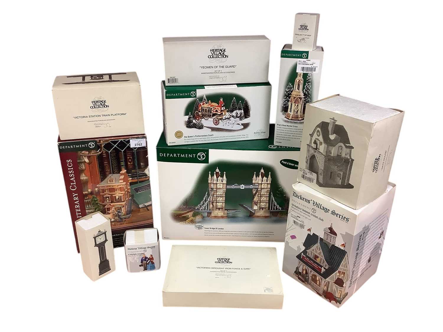 Lot 2762 - Group of Department 56 Christmas ornaments comprising Tower Bridge of London, King's Road Market Cross, Town Clock, English Post Box, Yeoman of the Guard, a fairytale romance, The Queen's Parlia...
