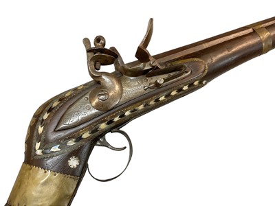 Lot 1065 - 19th century Arab jezail Flintlock musket with East India Company marked lock dated 1797 signed Brander, heavy octagonal flared barrel with staged rear sight , ornate mother o pearl inlaid stock,...