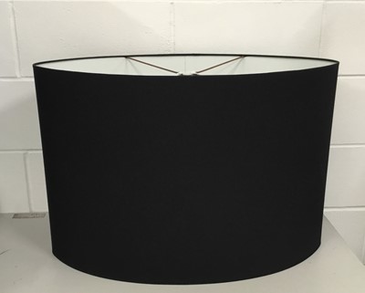 Lot 210 - Two very large black oval lamp shades, 51cm high x 76cm wide and 45.5cm high x 56cm wide