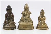 Lot 1016 - Three Tibetan bronze Buddha figures - the...