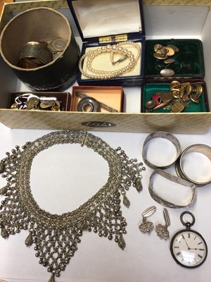 Lot 1010 - Eastern white metal tassel chocker necklace, pair of silver (835) filigree cufflinks, other cufflinks and studs, three silver napkin rings, silver cased fob watch, coins and bijouterie