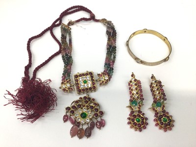 Lot 1025 - Indian tourmaline bead and gem set pendant necklace and pair of matching earrings, together with a gilt metal gem set bangle