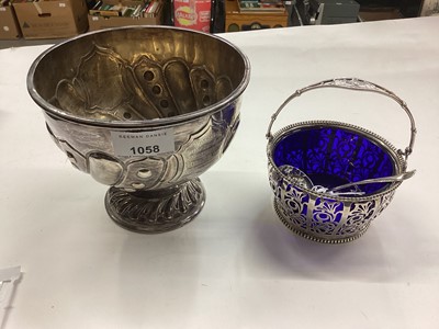 Lot 1058 - Edwardian silver rose bowl (Sheffield 1904) and a 1920s pierced silver sugar basket with blue glass liner and sifter spoon (3)