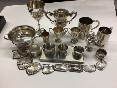 Lot 1060 - Group of silver items to include two christening mugs, four trophies, napkin rings, cigarette case, spirit labels, white metal and silver items