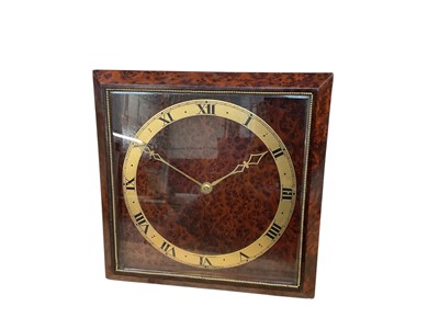 Lot 21 - Art Deco Asprey clock with 8 day movement in a figured burr walnut bevelled glazed case with easel style stand, dial signed 'Asprey London' (with key).