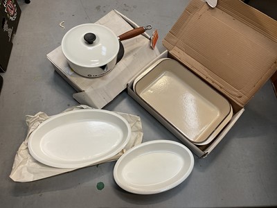 Lot 450 - Le Creuset white cast iron saucepan no 22, new in box, together with three Le Creuset oven dishes