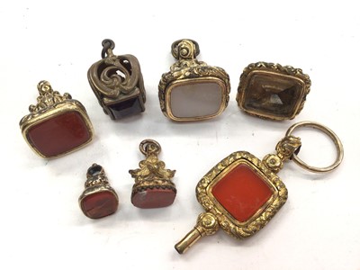 Lot 1105 - Group of seven Regency and 19th century gilt metal seals to include a fob/pocket watch key