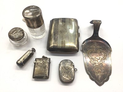 Lot 1039 - Silver cigarette case, two silver vesta cases, silver cheroot holder, silver topped glass jar and perfume bottle