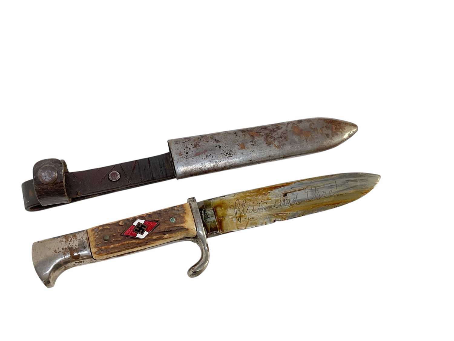 Lot 851 - Nazi Hitler Youth knife / dagger with two piece stag horn grip, set with enamel swastika badge, plated mounts, engraved blade marked 'Blut und Ehre!' RZM M7/27 1938, in scabbard