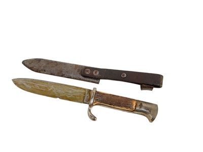 Lot 851 - Nazi Hitler Youth knife / dagger with two piece stag horn grip, set with enamel swastika badge, plated mounts, engraved blade marked 'Blut und Ehre!' RZM M7/27 1938, in scabbard
