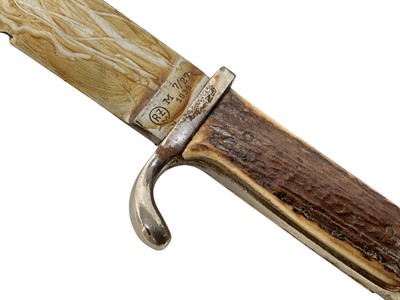 Lot 851 - Nazi Hitler Youth knife / dagger with two piece stag horn grip, set with enamel swastika badge, plated mounts, engraved blade marked 'Blut und Ehre!' RZM M7/27 1938, in scabbard