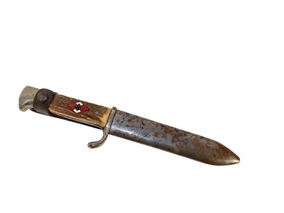 Lot 851 - Nazi Hitler Youth knife / dagger with two piece stag horn grip, set with enamel swastika badge, plated mounts, engraved blade marked 'Blut und Ehre!' RZM M7/27 1938, in scabbard