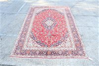 Lot 1760 - Kashan carpet - brick-red field with...