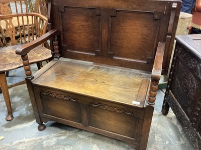 Lot 1243 - Oak monks bench with folding top, rising seat and panelled blanket box base with bobbin turned supports 91cm wide