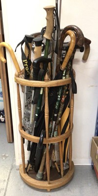 Lot 333 - Wooden stick stand with various walking sticks etc