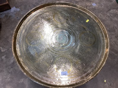 Lot 1245 - Indian Benares brass circular coffee table on folding wooden stand