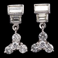 Lot 665 - Pair Art Deco-style diamond drop earrings,...